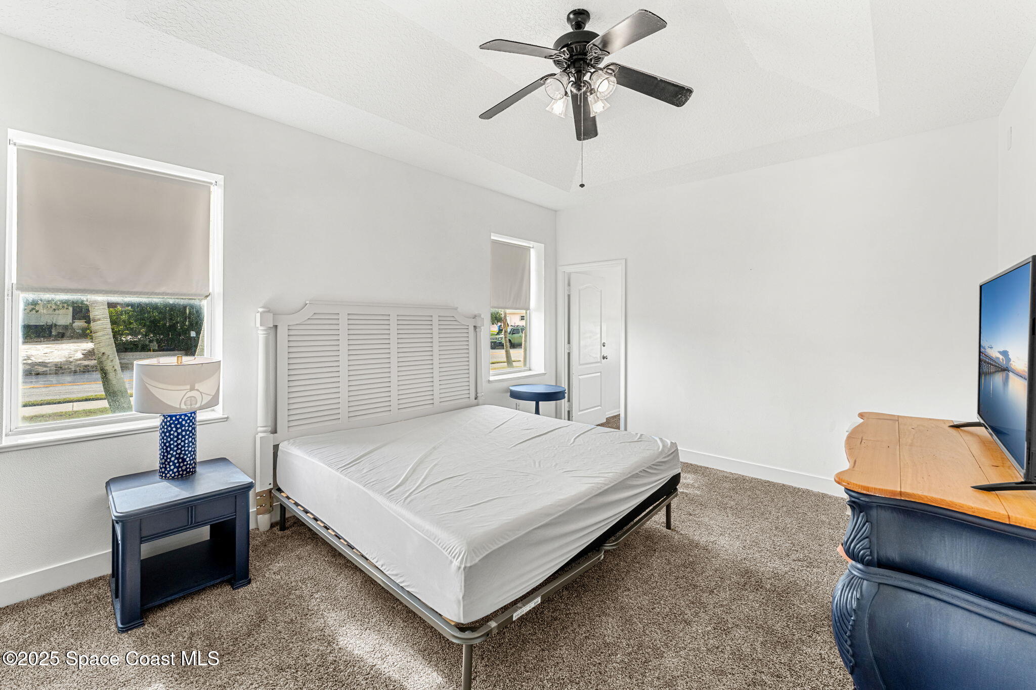 48 Harbor Circle Cocoa Beach, FL 32931 - Photo 22 of 48 a bedroom with a bed and window