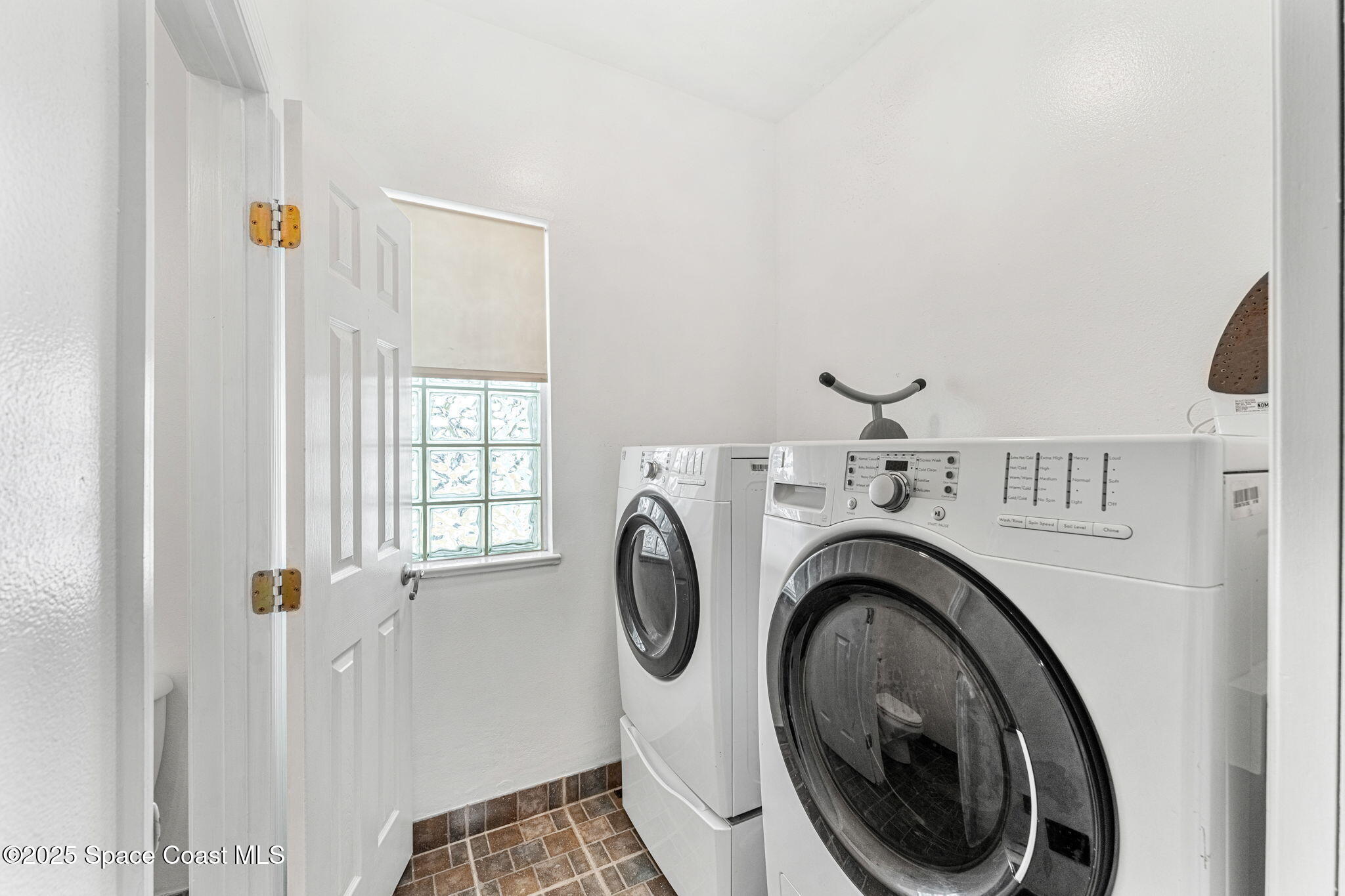 48 Harbor Circle Cocoa Beach, FL 32931 - Photo 28 of 48 a view of storage and utility room with washer and dryer