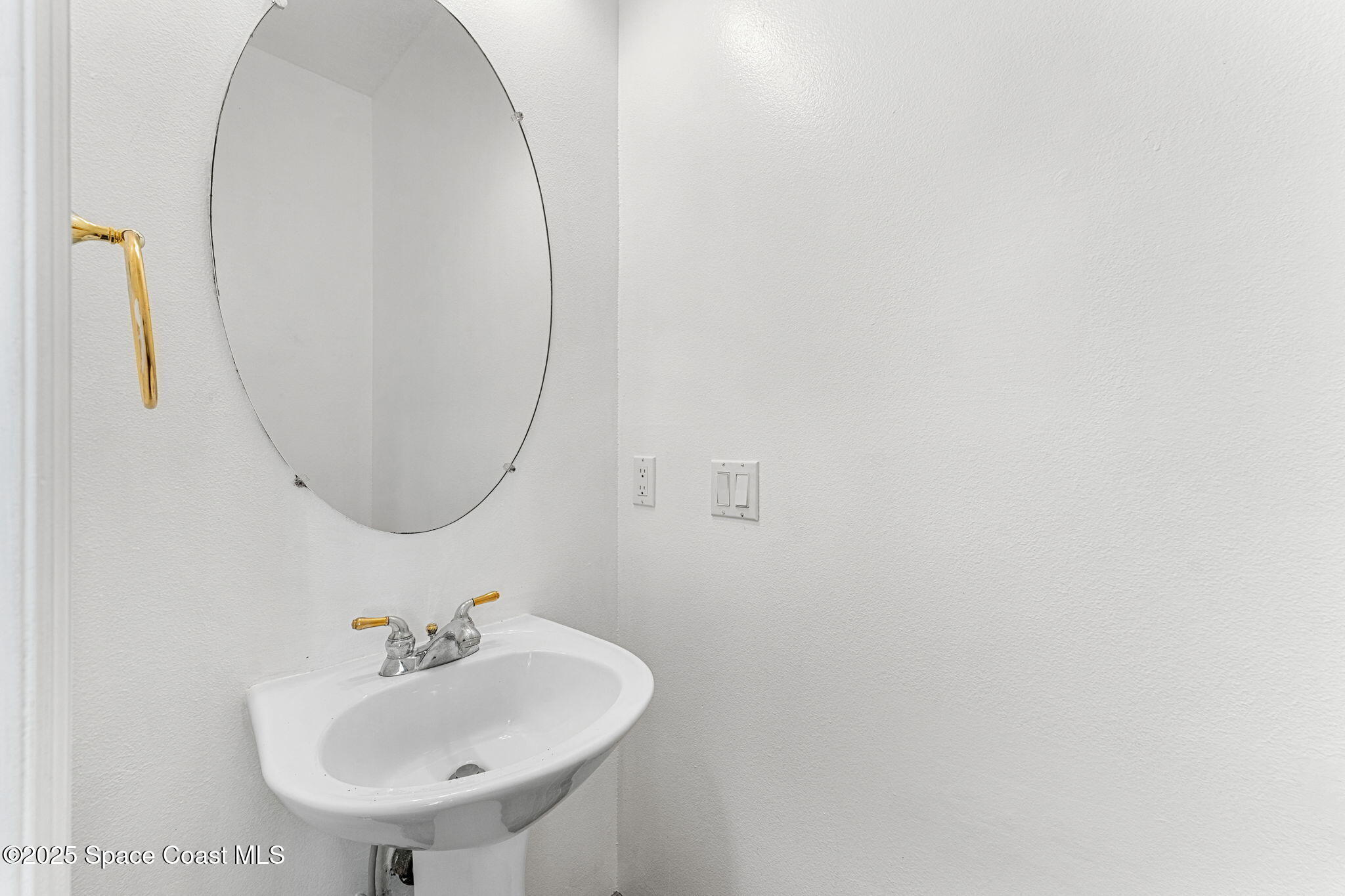 48 Harbor Circle Cocoa Beach, FL 32931 - Photo 29 of 48 a bathroom with a sink and a mirror