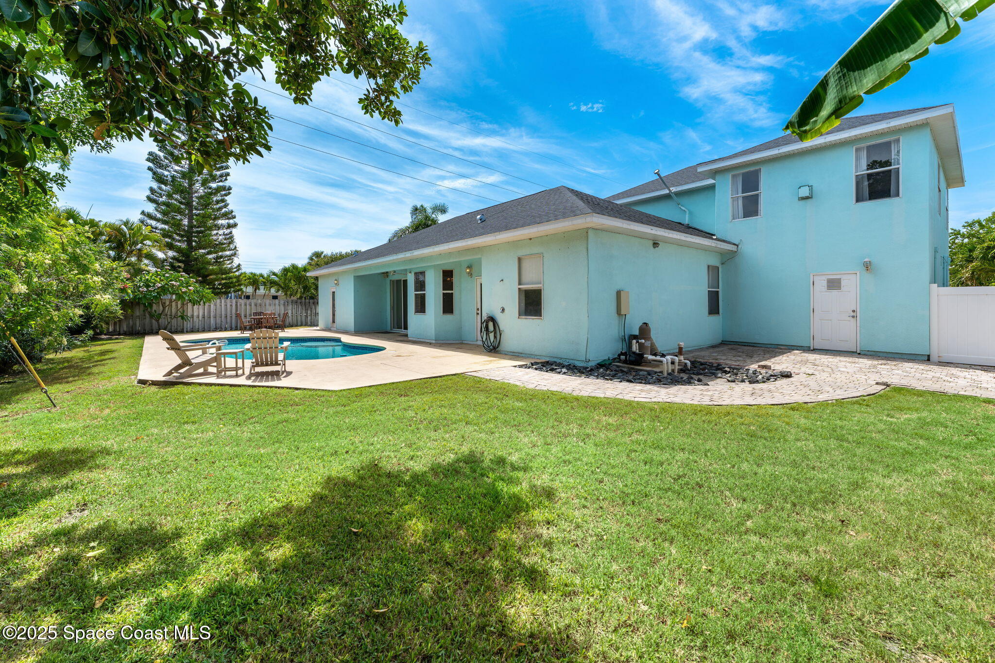 48 Harbor Circle Cocoa Beach, FL 32931 - Photo 3 of 48 a front view of a house with a yard