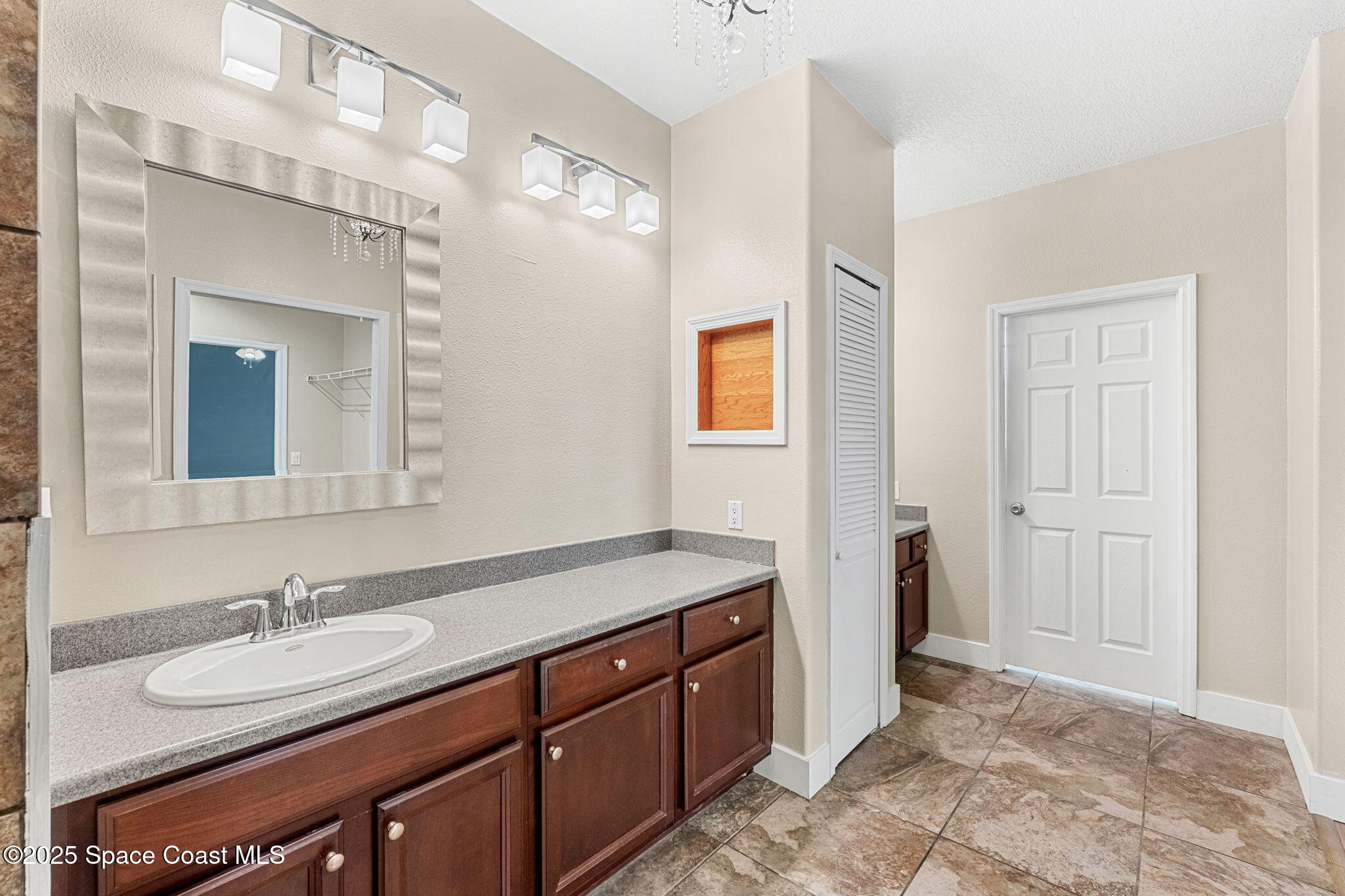 48 Harbor Circle Cocoa Beach, FL 32931 - Photo 35 of 48 a bathroom with a sink double vanity and a mirror