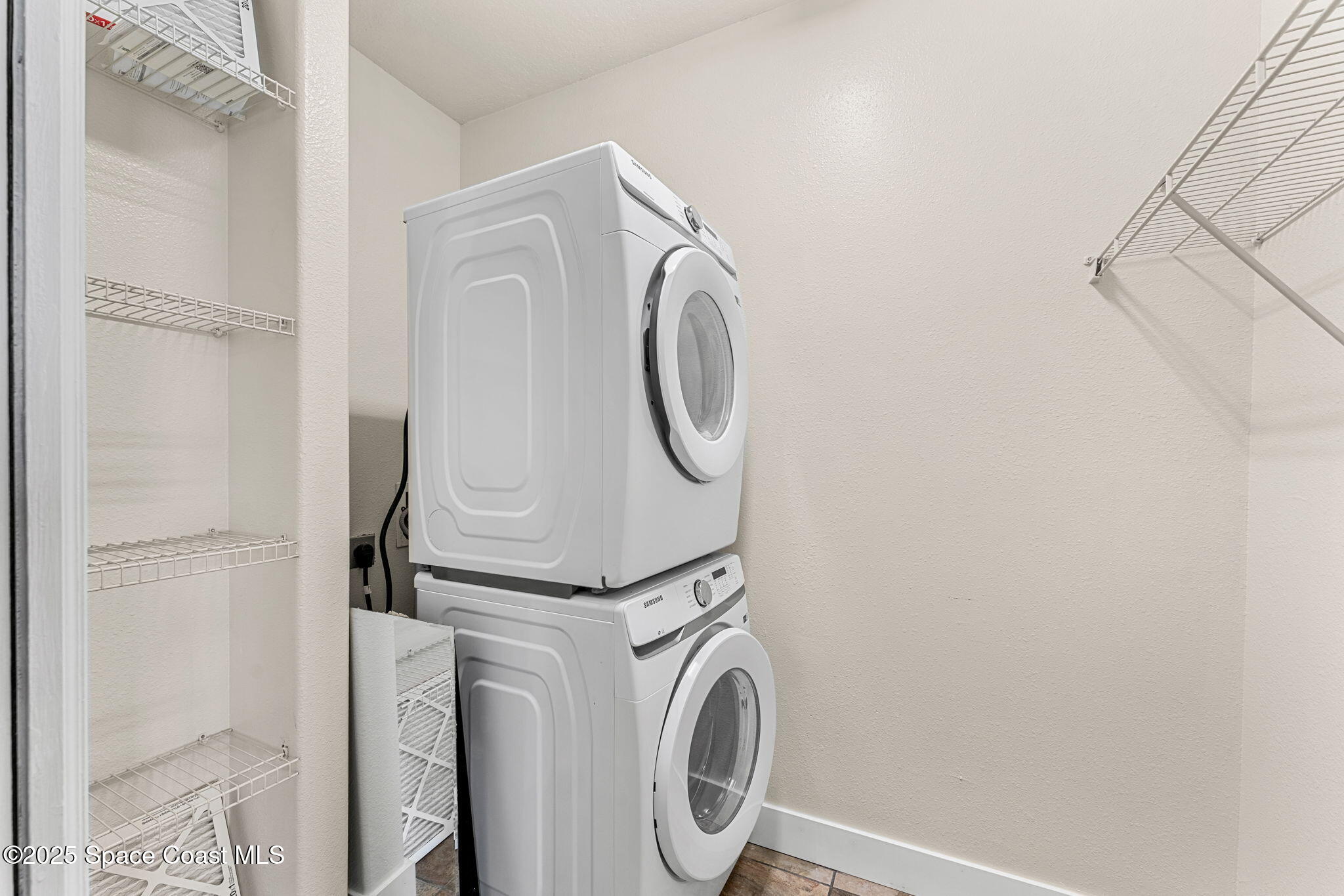 48 Harbor Circle Cocoa Beach, FL 32931 - Photo 37 of 48 a utility room with dryer and washer