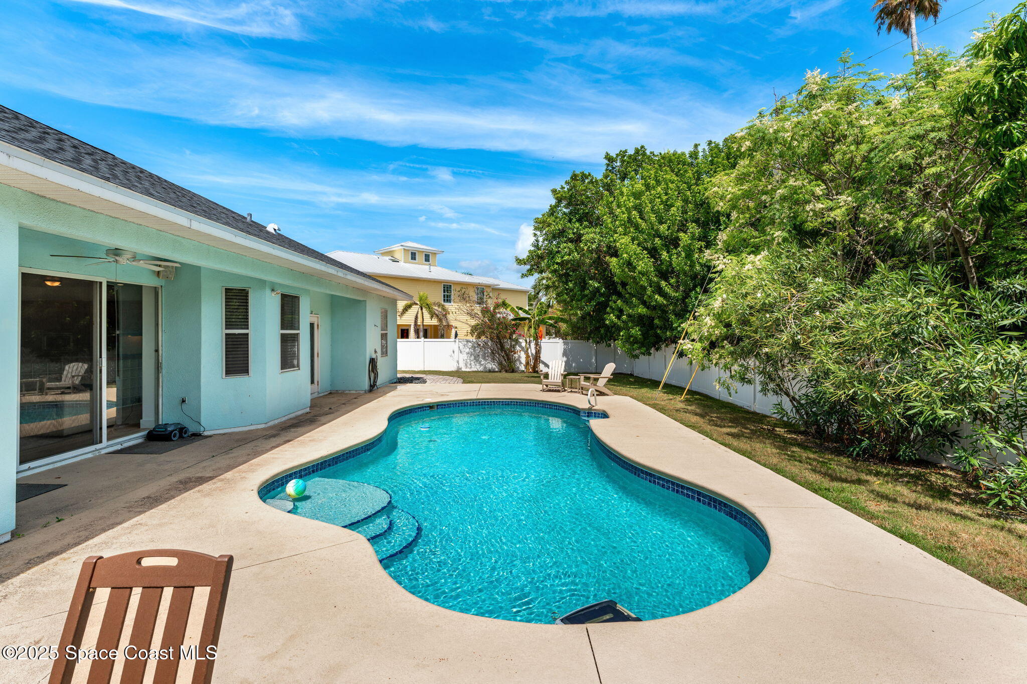 48 Harbor Circle Cocoa Beach, FL 32931 - Photo 38 of 48 a view of a swimming pool with a patio