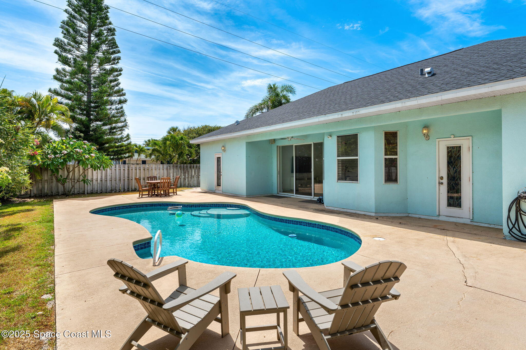 48 Harbor Circle Cocoa Beach, FL 32931 - Photo 40 of 48 a swimming pool with outdoor seating and yard