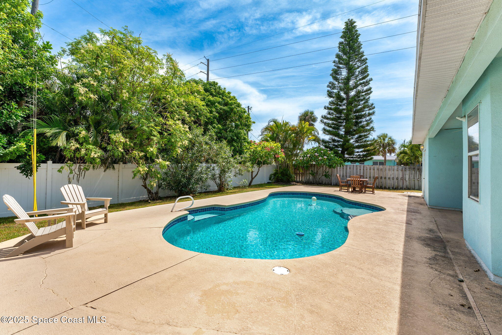 48 Harbor Circle Cocoa Beach, FL 32931 - Photo 4 of 48 a view of swimming pool with seating space