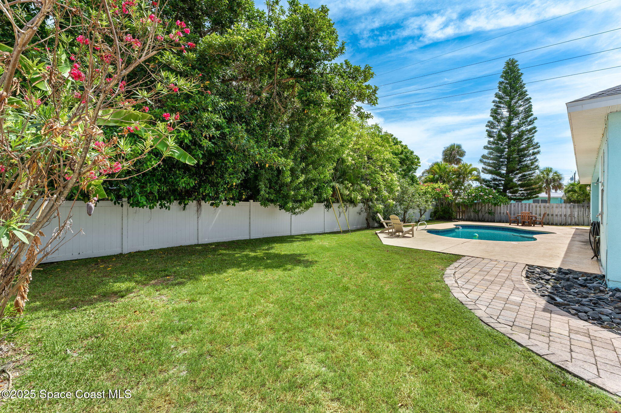 48 Harbor Circle Cocoa Beach, FL 32931 - Photo 42 of 48 a view of a yard with a house