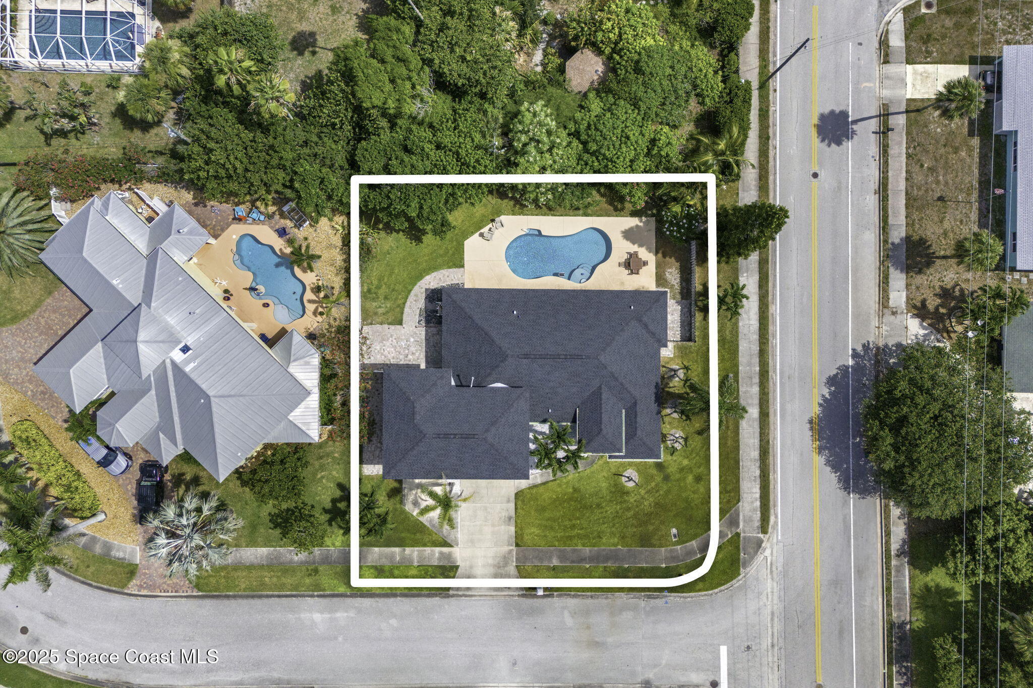 48 Harbor Circle Cocoa Beach, FL 32931 - Photo 44 of 48 an aerial view of a house with garden space and street view