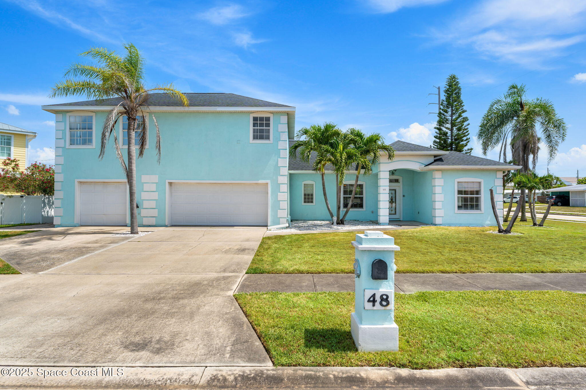 48 Harbor Circle Cocoa Beach, FL 32931 - Photo 47 of 48 front view of house with a yard