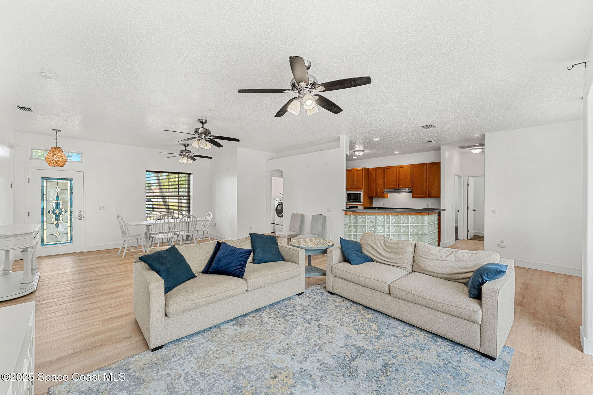 48 Harbor Circle Cocoa Beach, FL 32931 - Photo 6 of 48 a living room with furniture and a flat screen tv