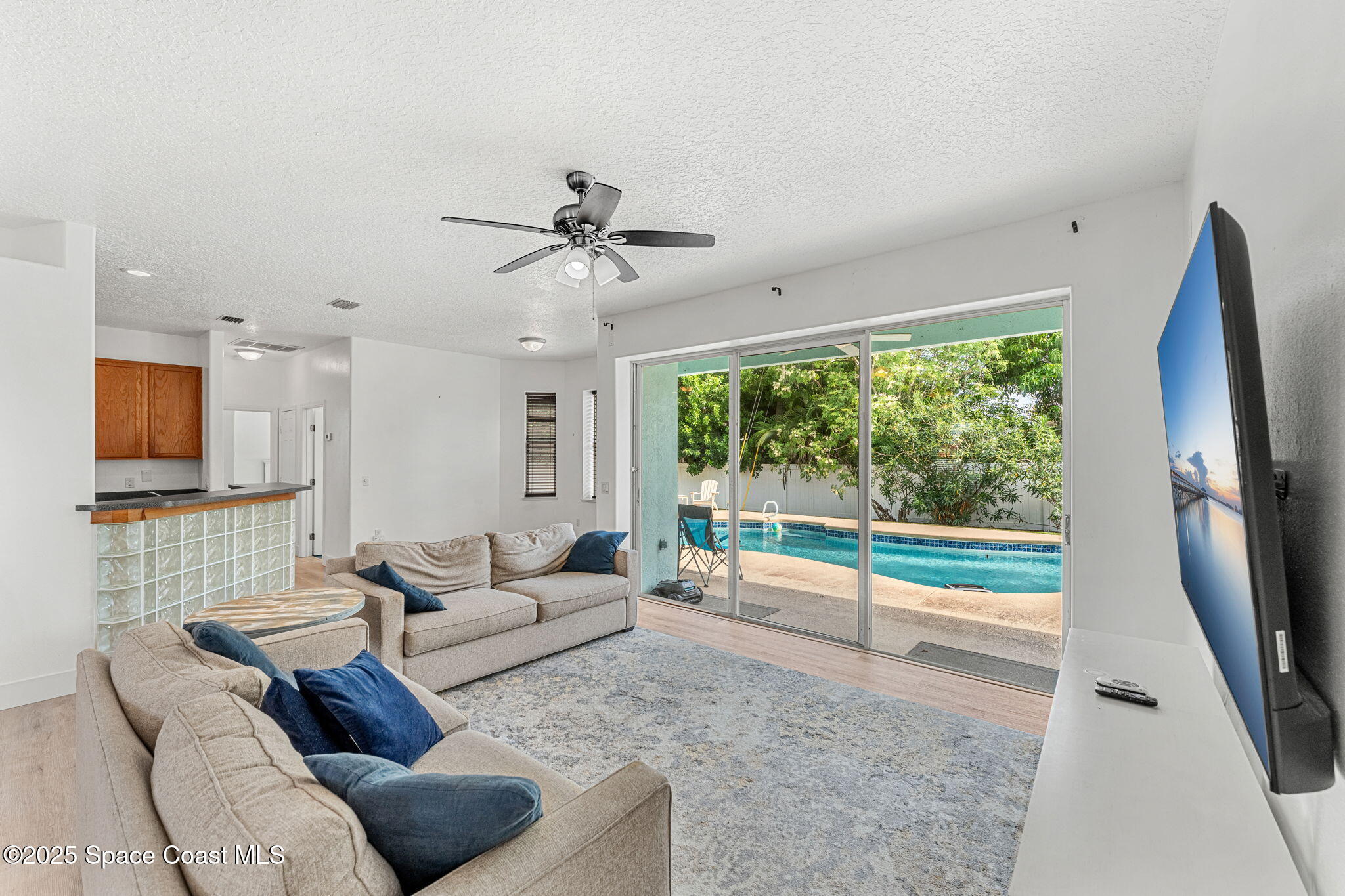 48 Harbor Circle Cocoa Beach, FL 32931 - Photo 7 of 48 a living room with furniture and a flat screen tv