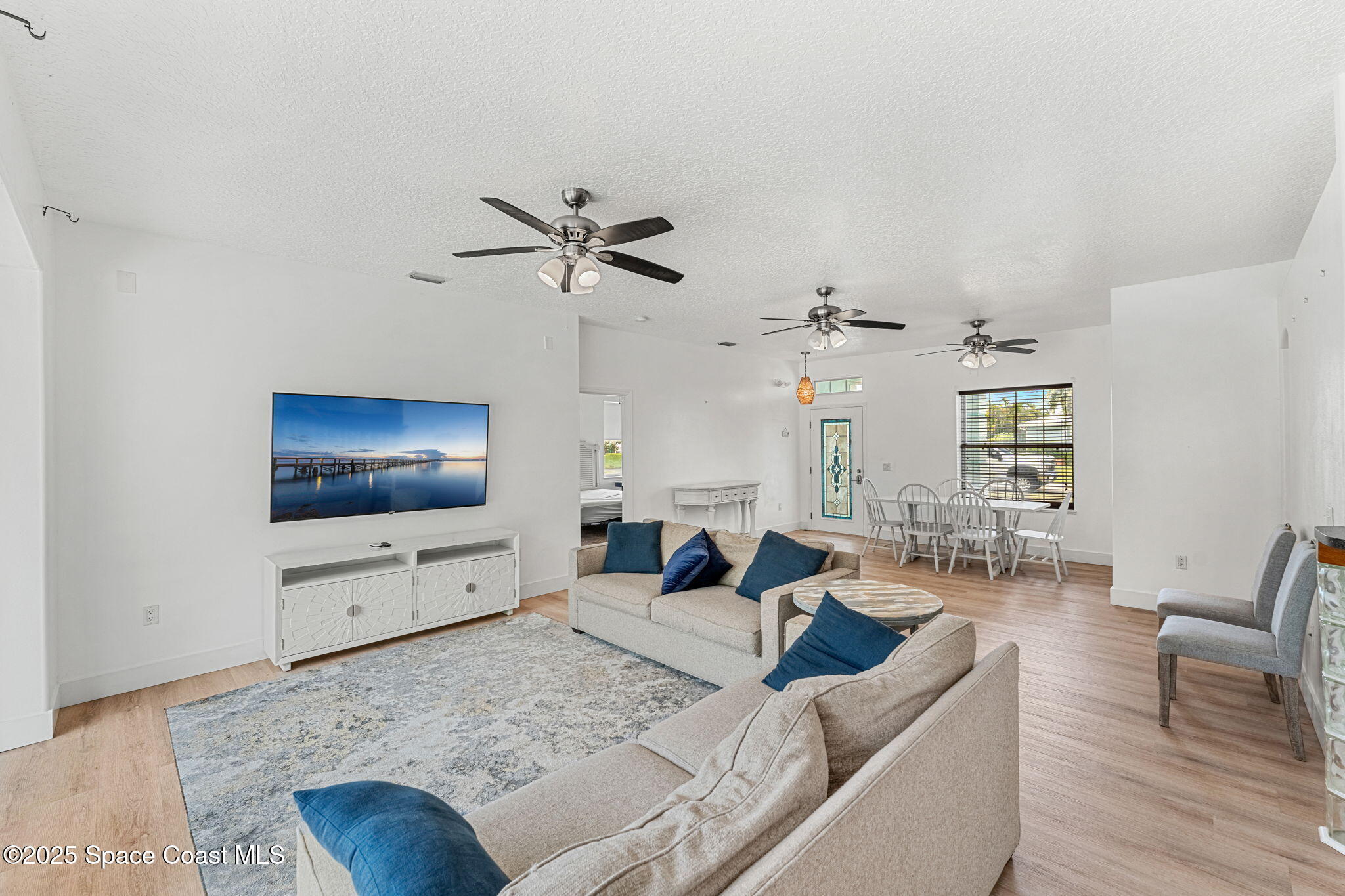 48 Harbor Circle Cocoa Beach, FL 32931 - Photo 8 of 48 a living room with furniture and a flat screen tv