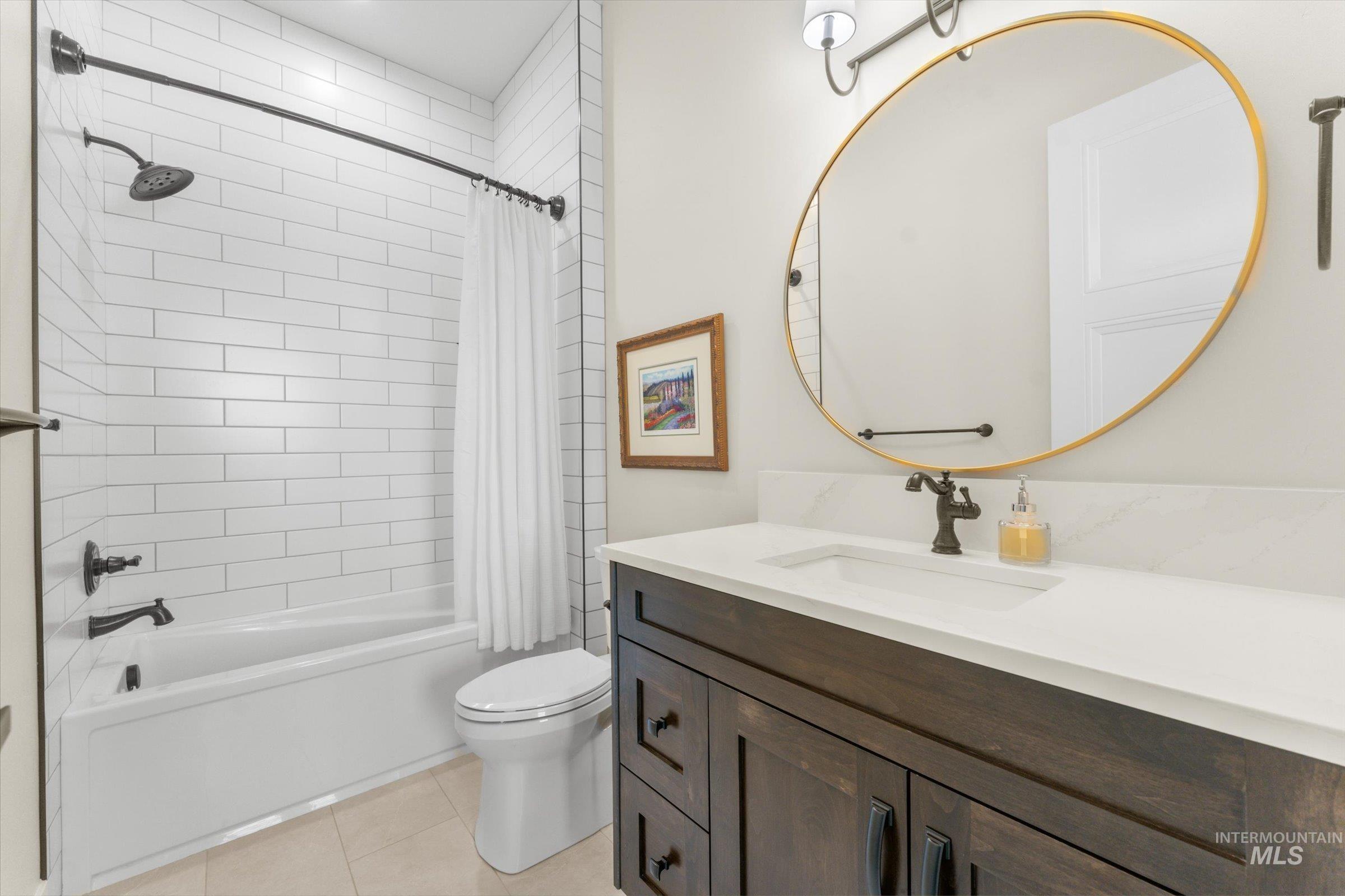6585 South Pemberley Way Meridian, ID 83642 - Photo 31 of 43 Bathroom featuring a dark wood-finish vanity with a white countertop and integrated sink