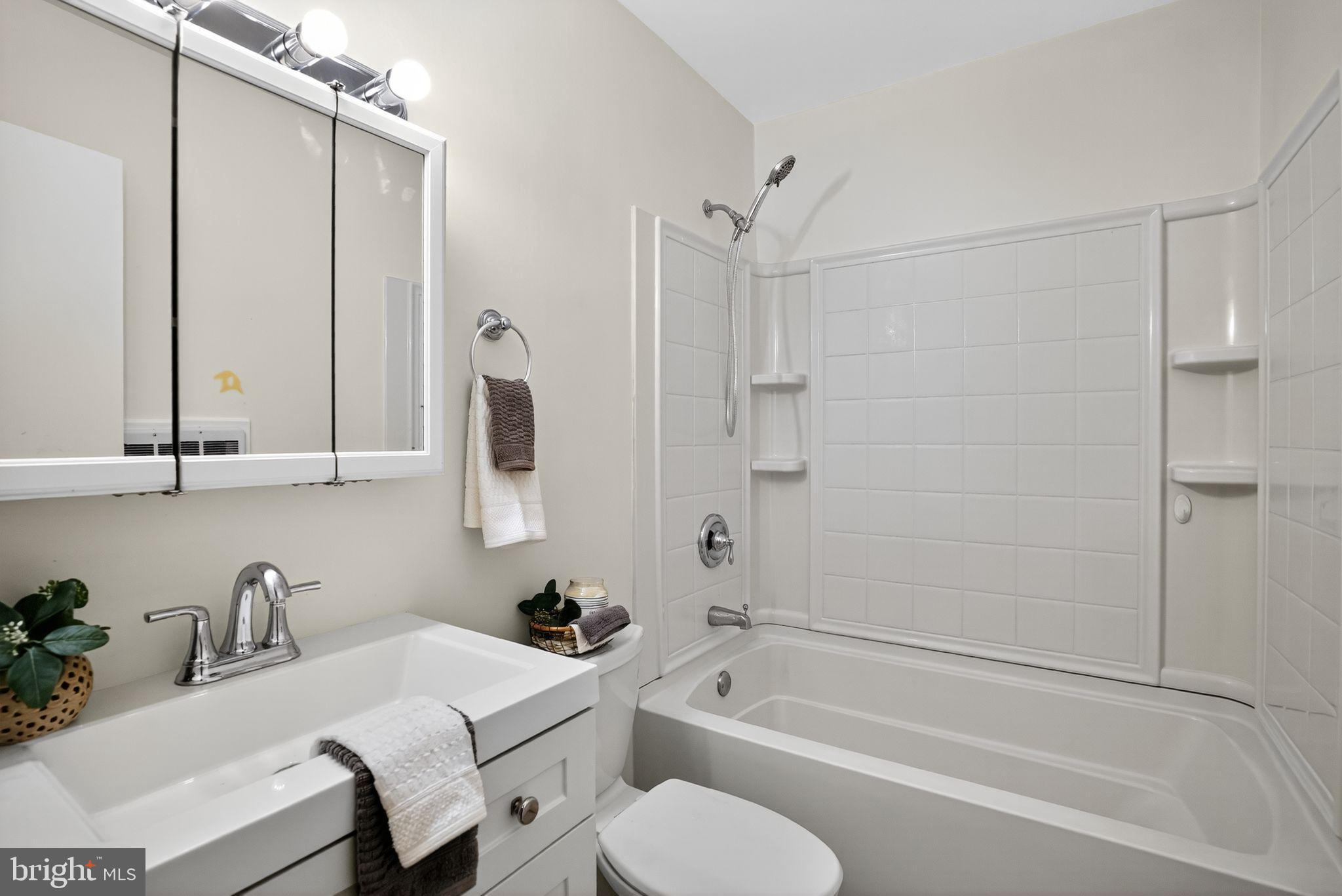 178 Elephant Road, Unit A6 Dublin, PA 18917 - Photo 14 of 17 a bathroom with a granite countertop sink toilet and shower