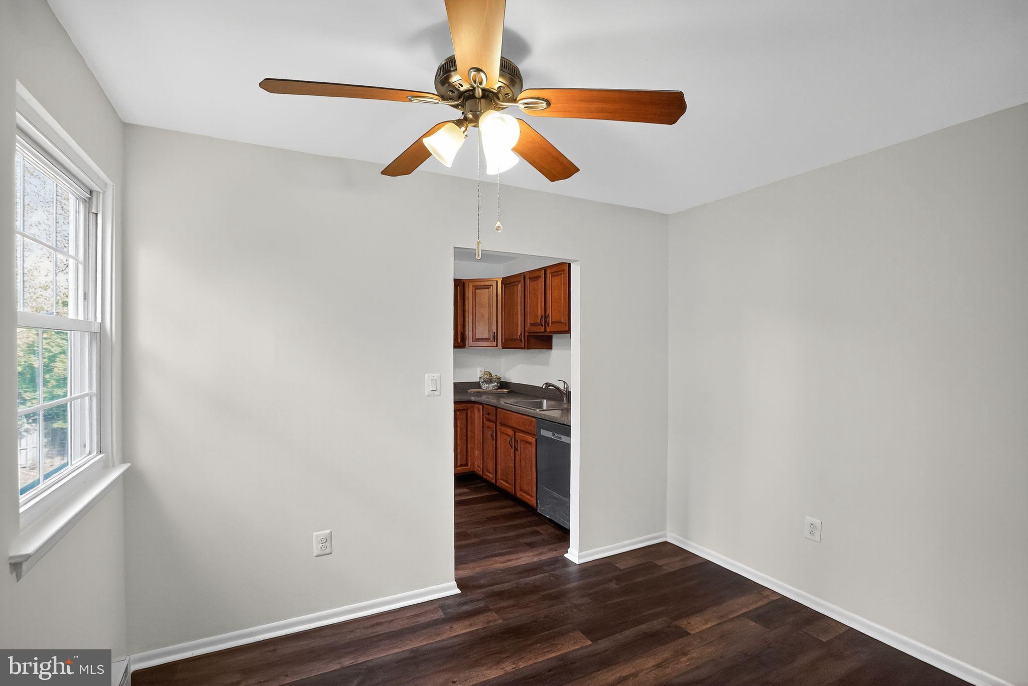 178 Elephant Road, Unit A6 Dublin, PA 18917 - Photo 5 of 17 a view of a kitchen with wooden floor a sink and a window