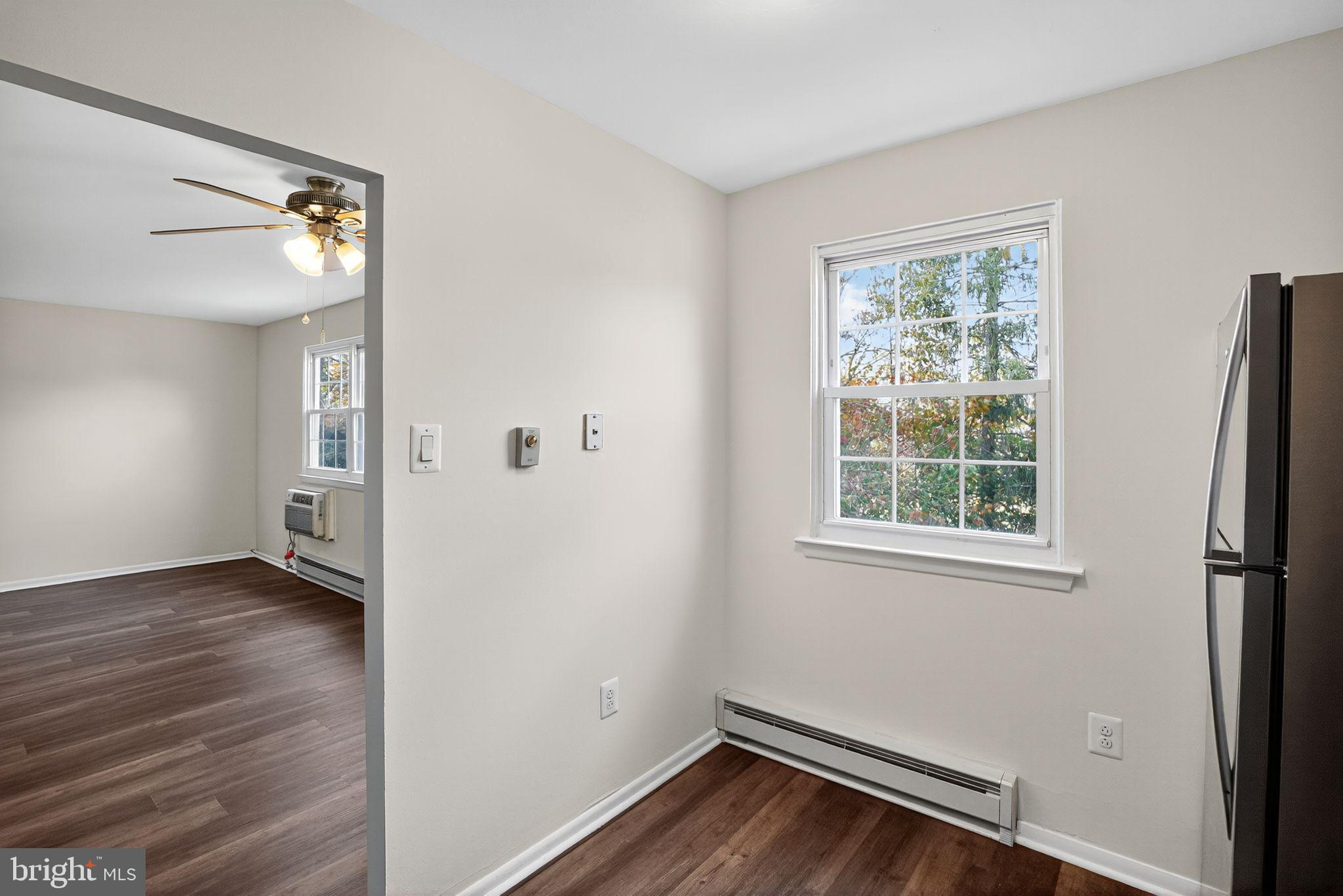 178 Elephant Road, Unit A6 Dublin, PA 18917 - Photo 10 of 17 an empty room with wooden floor and windows