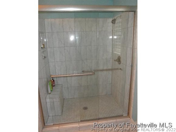2723 Huntington Road Fayetteville, NC 28303 - Photo 15 of 25 a bathroom with a shower
