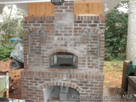 2723 Huntington Road Fayetteville, NC 28303 - Photo 21 of 25 a brick building with a outdoor space
