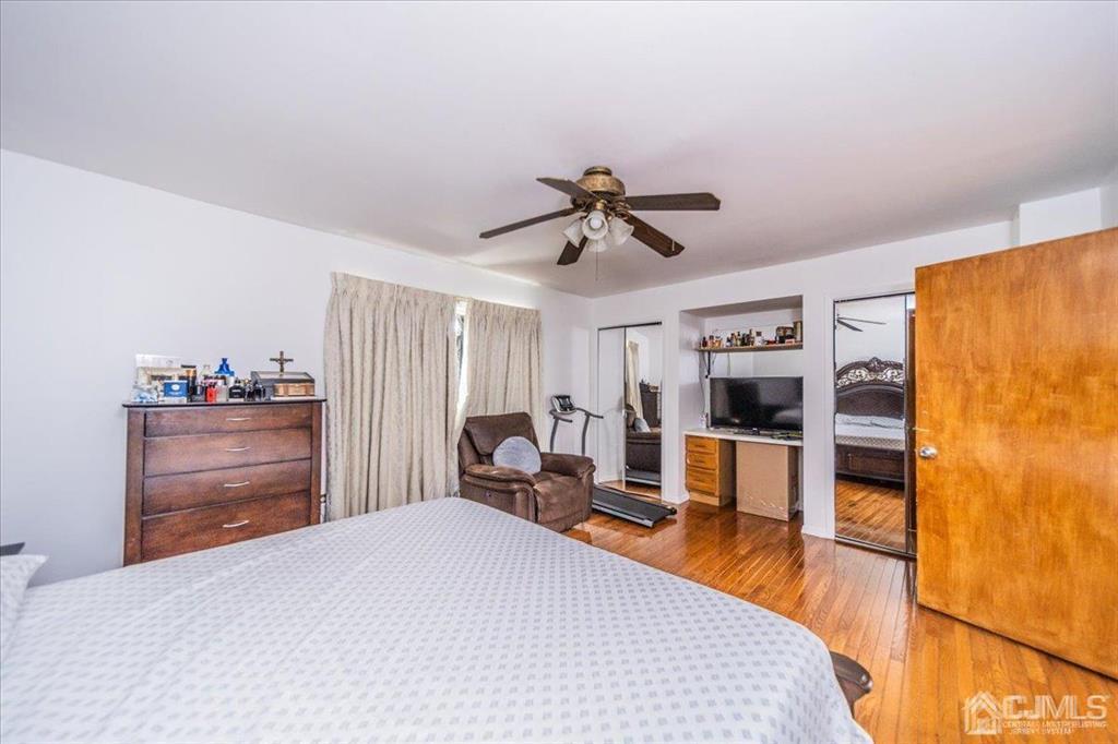454 Mitchell Place Perth Amboy, NJ 08861 - Photo 17 of 36 a bed room with a bed and furniture