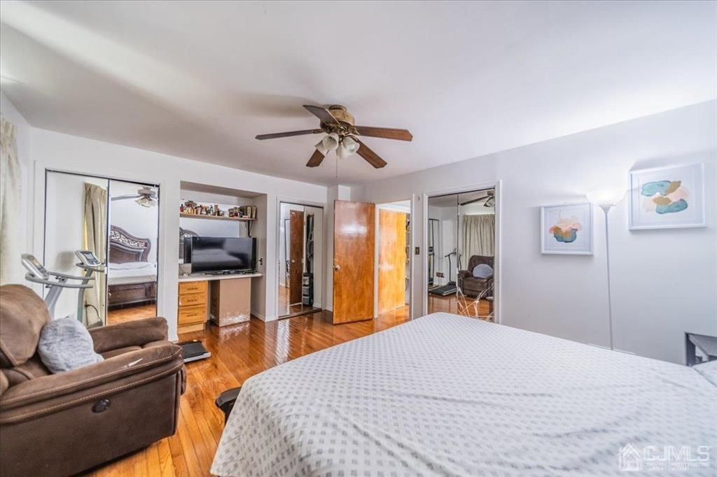 454 Mitchell Place Perth Amboy, NJ 08861 - Photo 18 of 36 a bed room with a bed and furniture