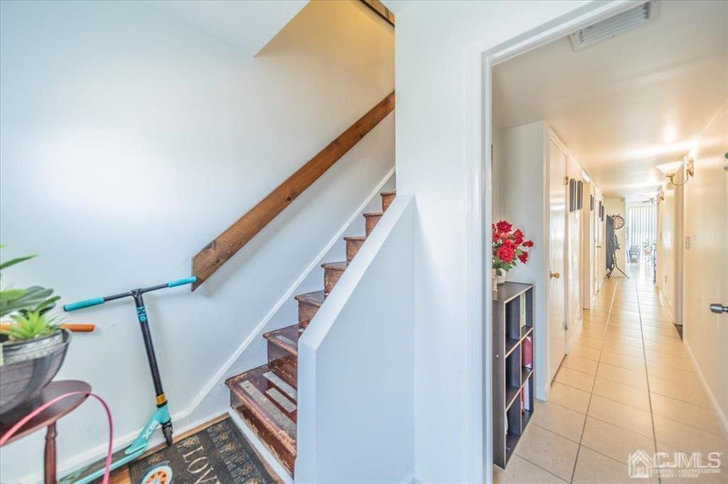 454 Mitchell Place Perth Amboy, NJ 08861 - Photo 31 of 36 a view of entryway with stairs and wooden floor