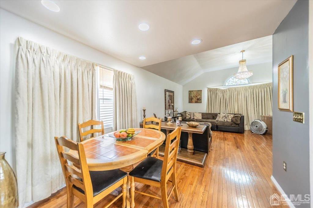 454 Mitchell Place Perth Amboy, NJ 08861 - Photo 8 of 36 a view of a dining room with furniture window and wooden floor