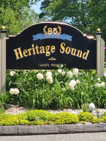 a view of outdoor space with signage and flags