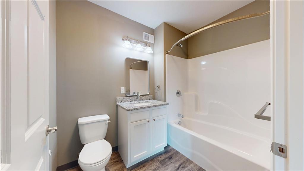 1450 Fifth Avenue, Unit 305 Pittsburgh, PA 15219 - Photo 17 of 22 a bathroom with a toilet a sink and bathtub