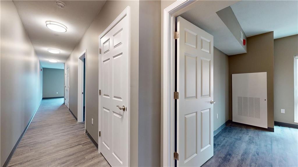 1450 Fifth Avenue, Unit 305 Pittsburgh, PA 15219 - Photo 5 of 22 a view of a hallway with wooden floor