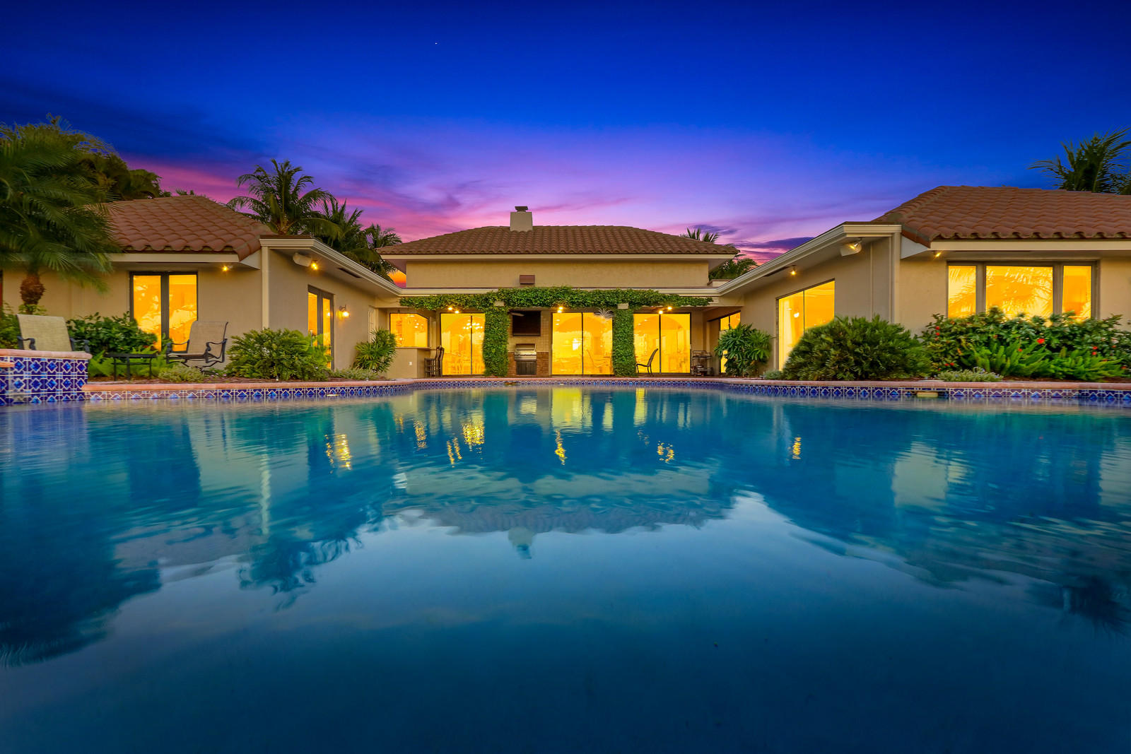 143 Point Circle Tequesta, FL 33469 - Photo 2 of 41 a front view of a house with a yard