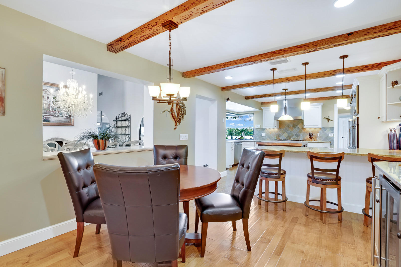 143 Point Circle Tequesta, FL 33469 - Photo 26 of 41 a dining room with furniture a chandelier and window