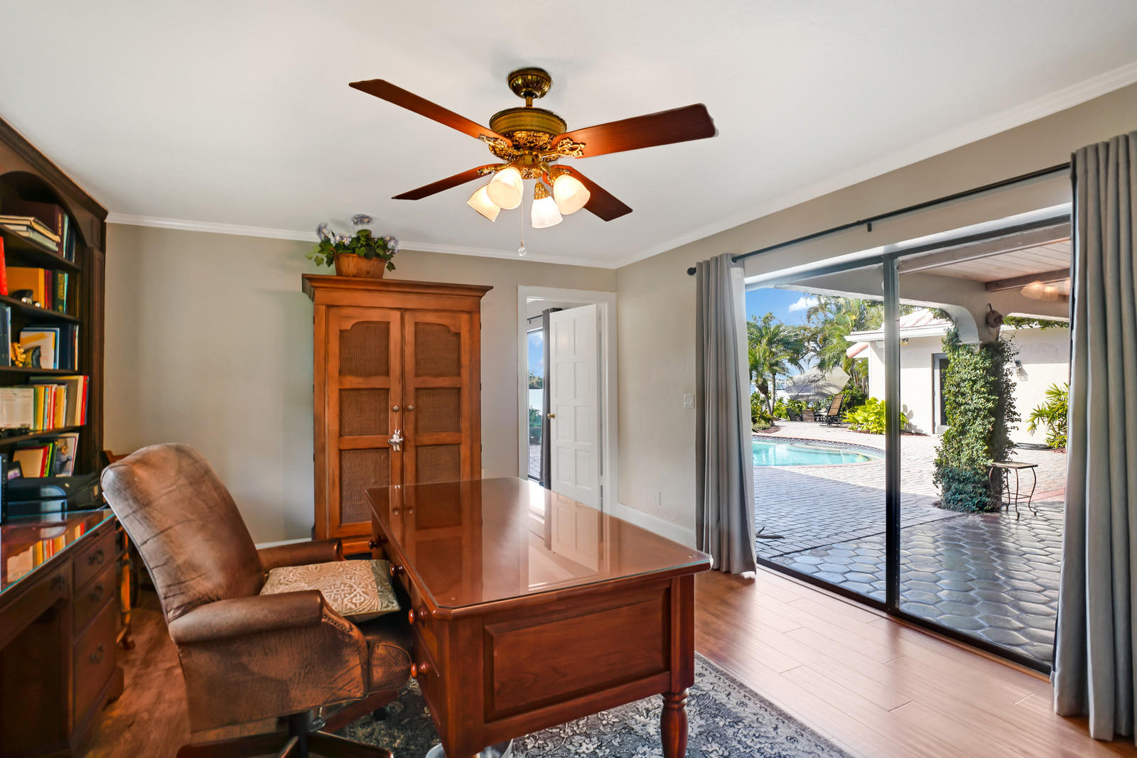 143 Point Circle Tequesta, FL 33469 - Photo 32 of 41 a workspace with furniture window and a ceiling fan