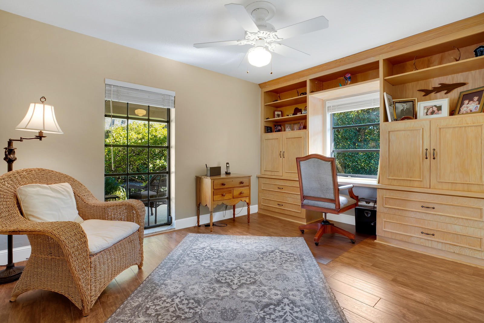 143 Point Circle Tequesta, FL 33469 - Photo 34 of 41 a living room with furniture a table and chair with the floor to ceiling window