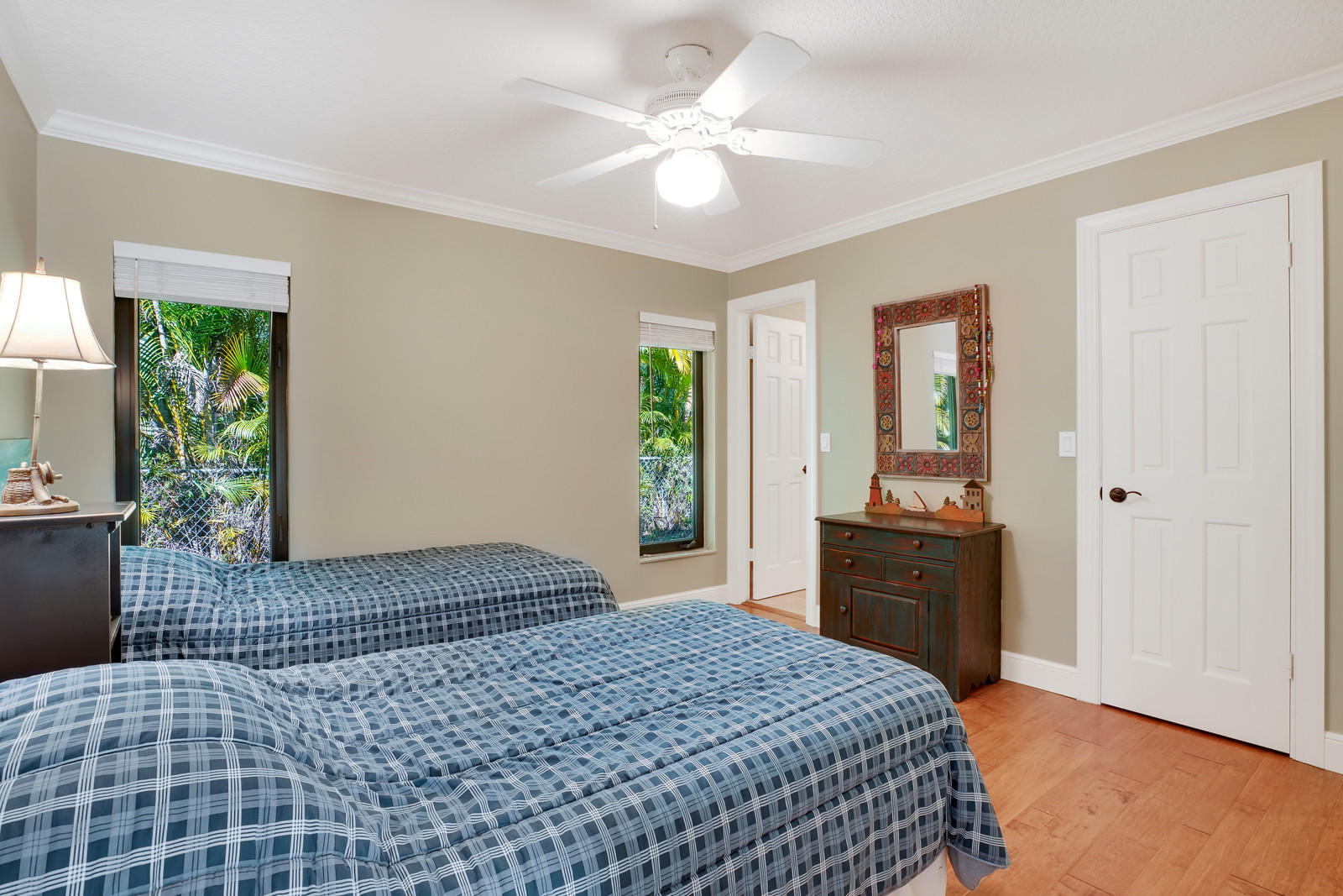 143 Point Circle Tequesta, FL 33469 - Photo 38 of 41 a bedroom with a bed and a dresser