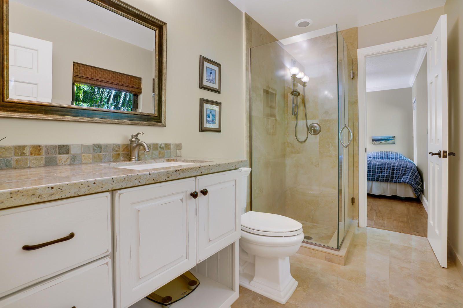 143 Point Circle Tequesta, FL 33469 - Photo 39 of 41 a bathroom with a sink a toilet and shower