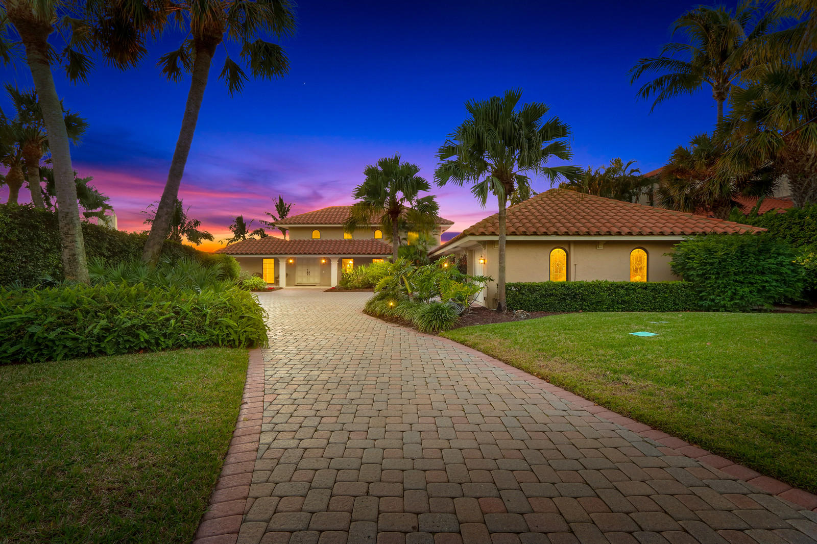143 Point Circle Tequesta, FL 33469 - Photo 6 of 41 a front view of a house with garden
