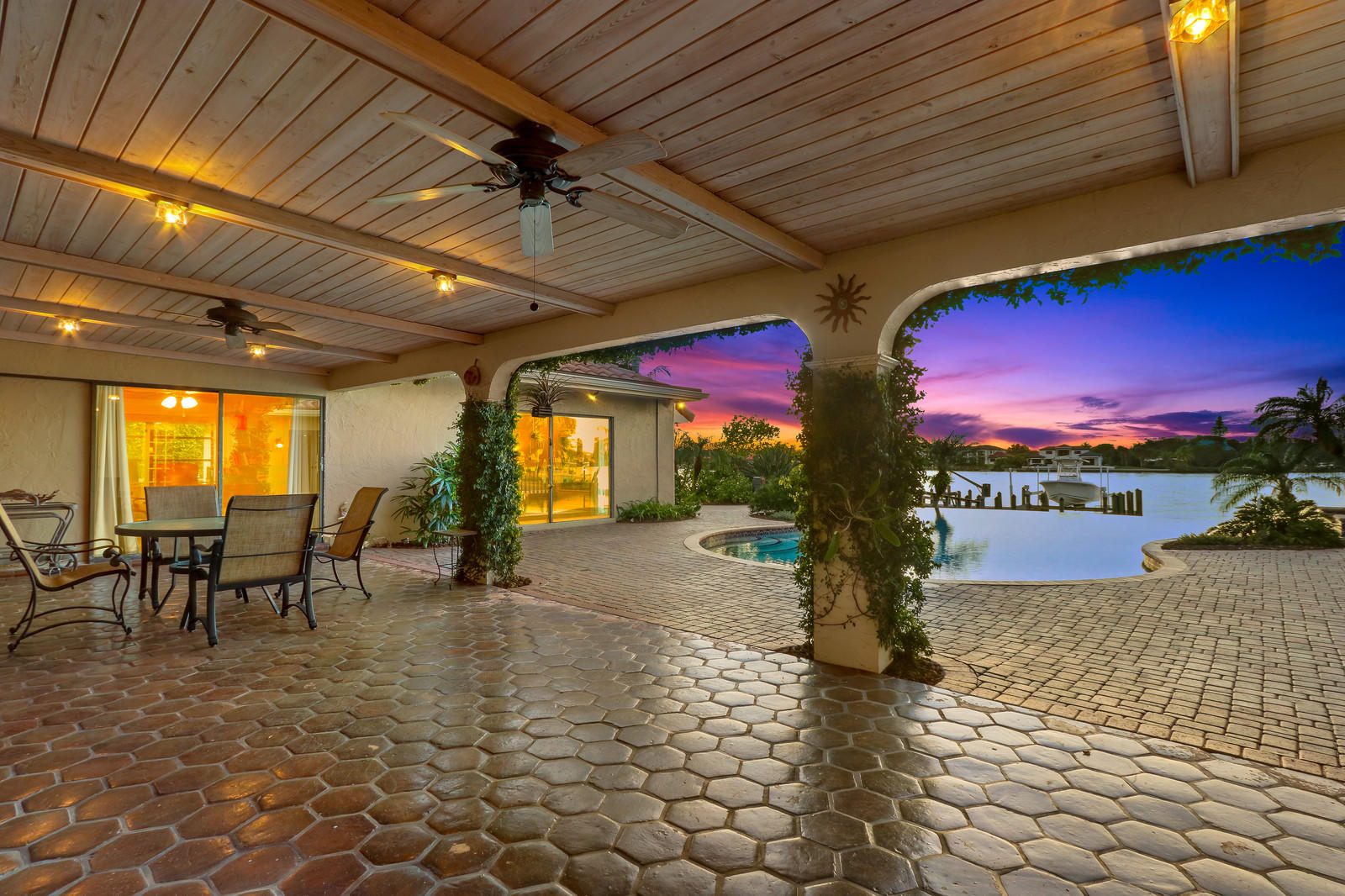 143 Point Circle Tequesta, FL 33469 - Photo 8 of 41 a building with swimming pool table and chairs