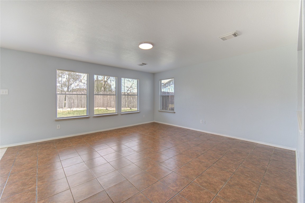 22919 Twisting Maple Court Spring, TX 77373 - Photo 14 of 49 wooden floor in an empty room with a window