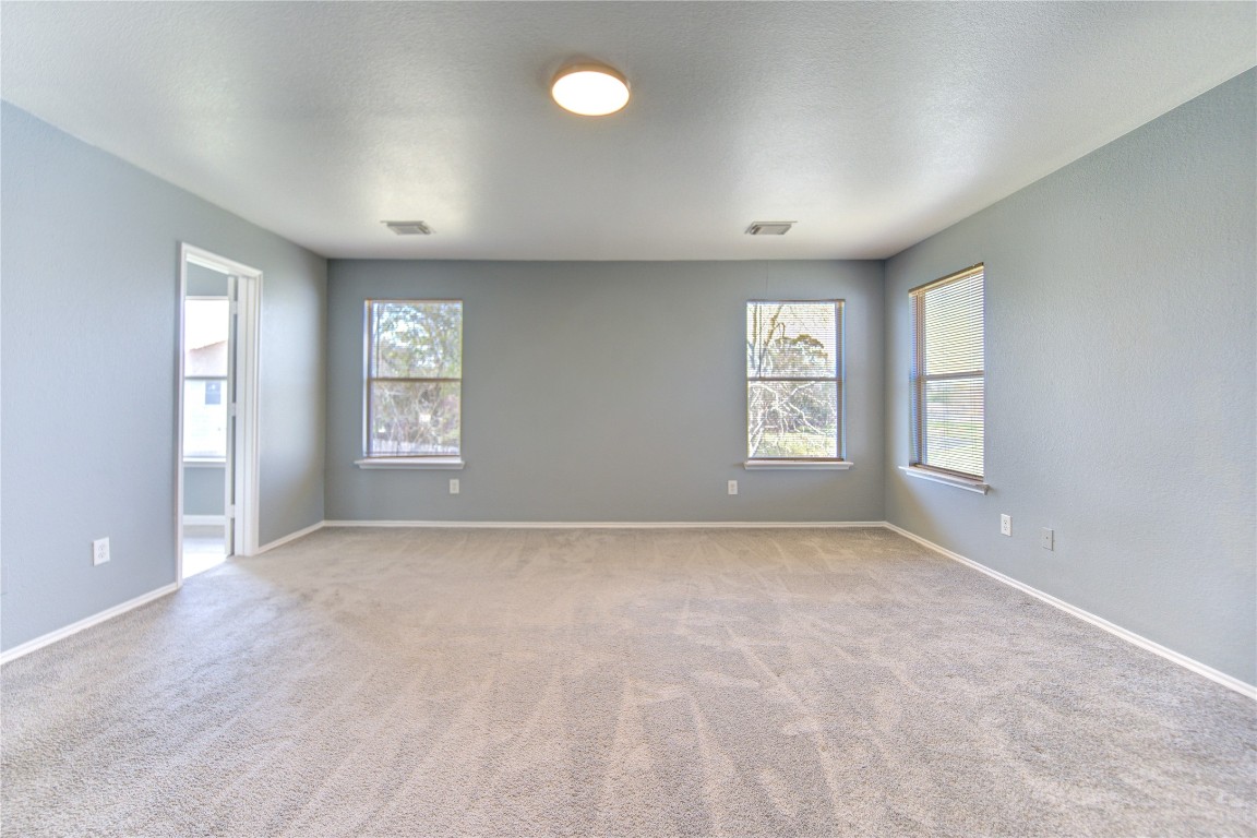 22919 Twisting Maple Court Spring, TX 77373 - Photo 30 of 49 an empty room with windows and closet