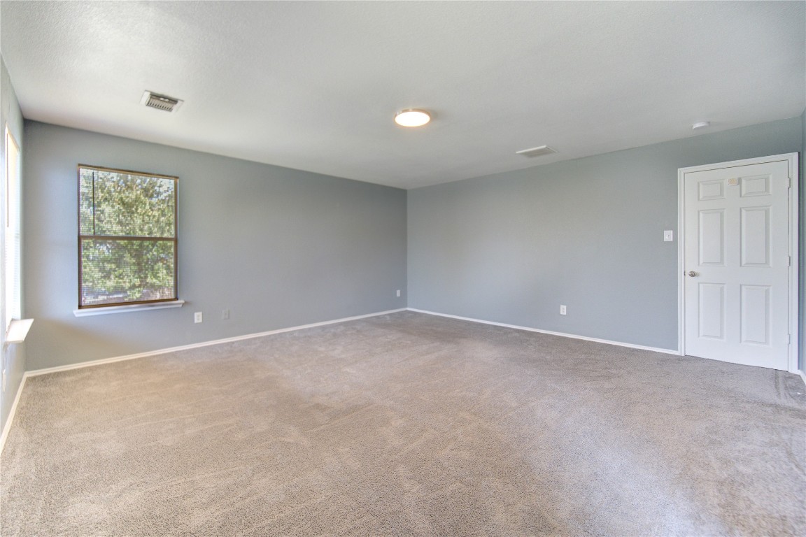 22919 Twisting Maple Court Spring, TX 77373 - Photo 32 of 49 an empty room with windows