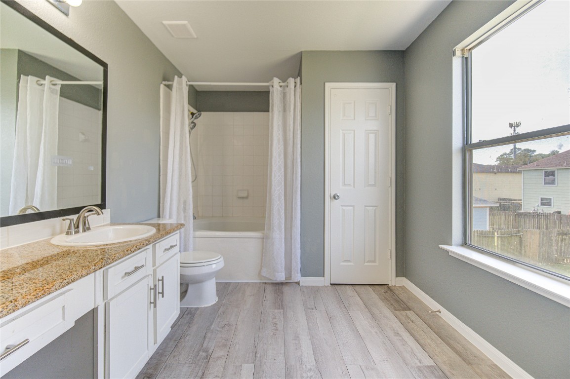 22919 Twisting Maple Court Spring, TX 77373 - Photo 33 of 49 a bathroom with a granite countertop sink toilet and shower