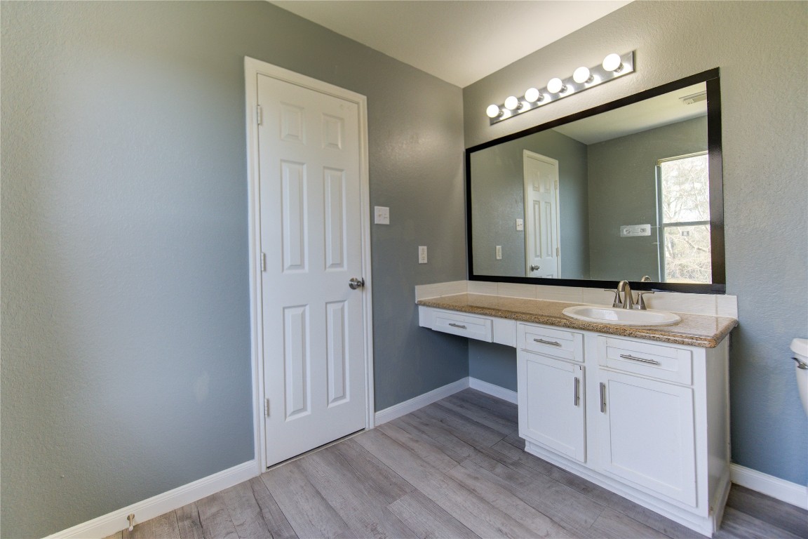 22919 Twisting Maple Court Spring, TX 77373 - Photo 34 of 49 a bathroom with a sink and a mirror