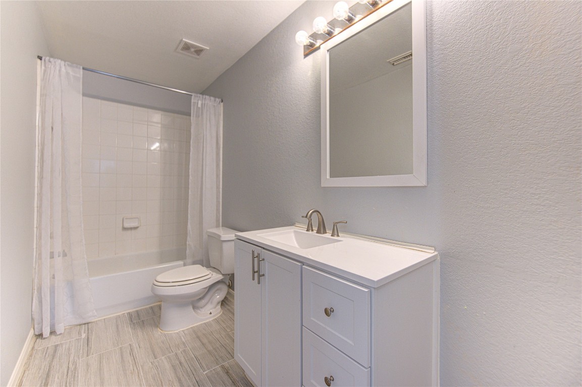 22919 Twisting Maple Court Spring, TX 77373 - Photo 37 of 49 a bathroom with a sink a toilet and a mirror