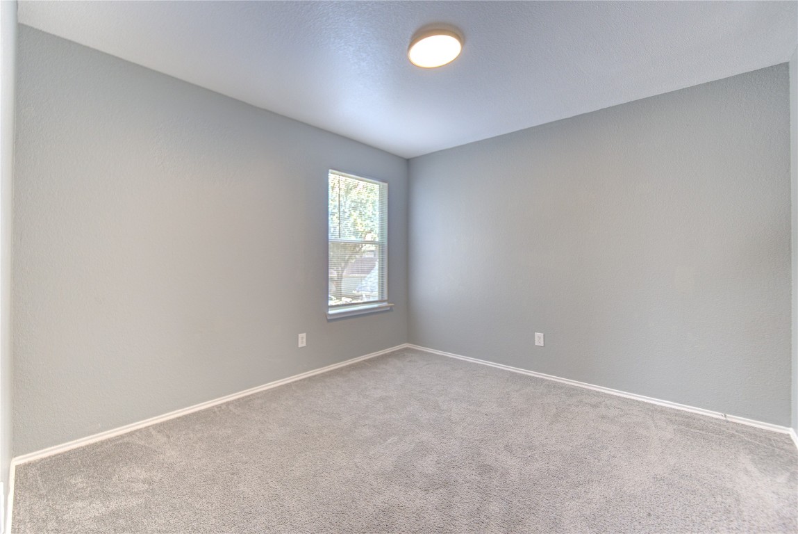 22919 Twisting Maple Court Spring, TX 77373 - Photo 38 of 49 an empty room with windows and closet area
