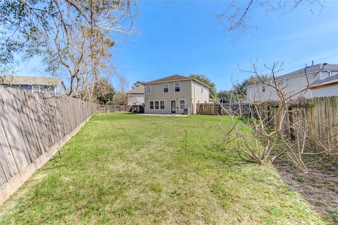 22919 Twisting Maple Court Spring, TX 77373 - Photo 45 of 49 a view of a house with a big yard