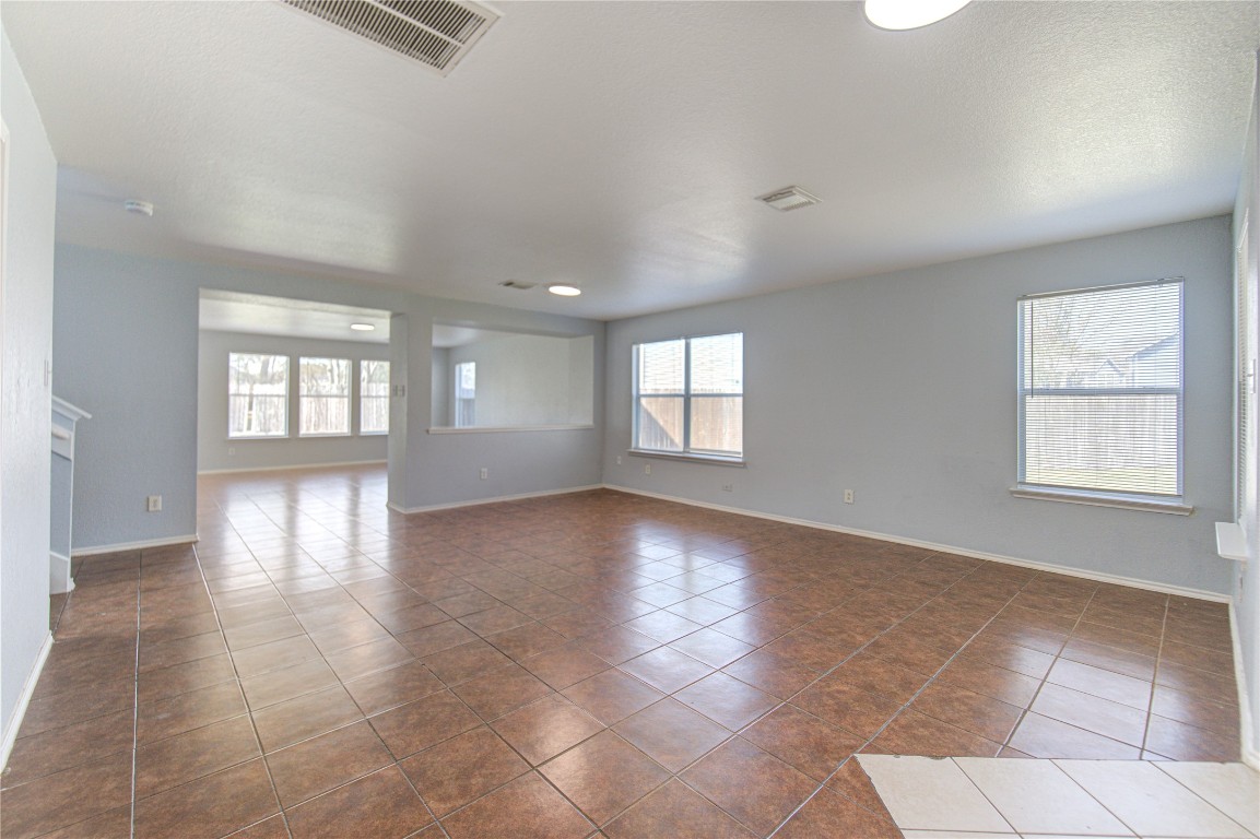 22919 Twisting Maple Court Spring, TX 77373 - Photo 6 of 49 a view of an empty room with a window and wooden floor