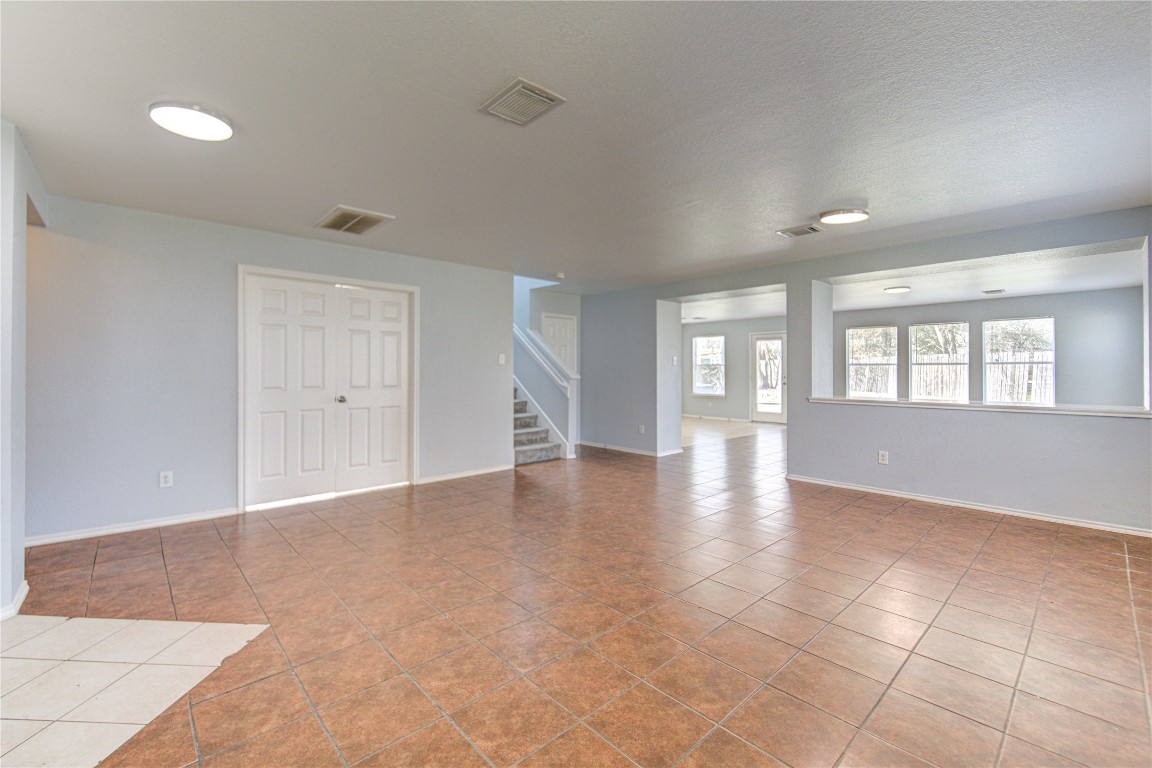 22919 Twisting Maple Court Spring, TX 77373 - Photo 7 of 49 a view of an empty room with a window and wooden floor