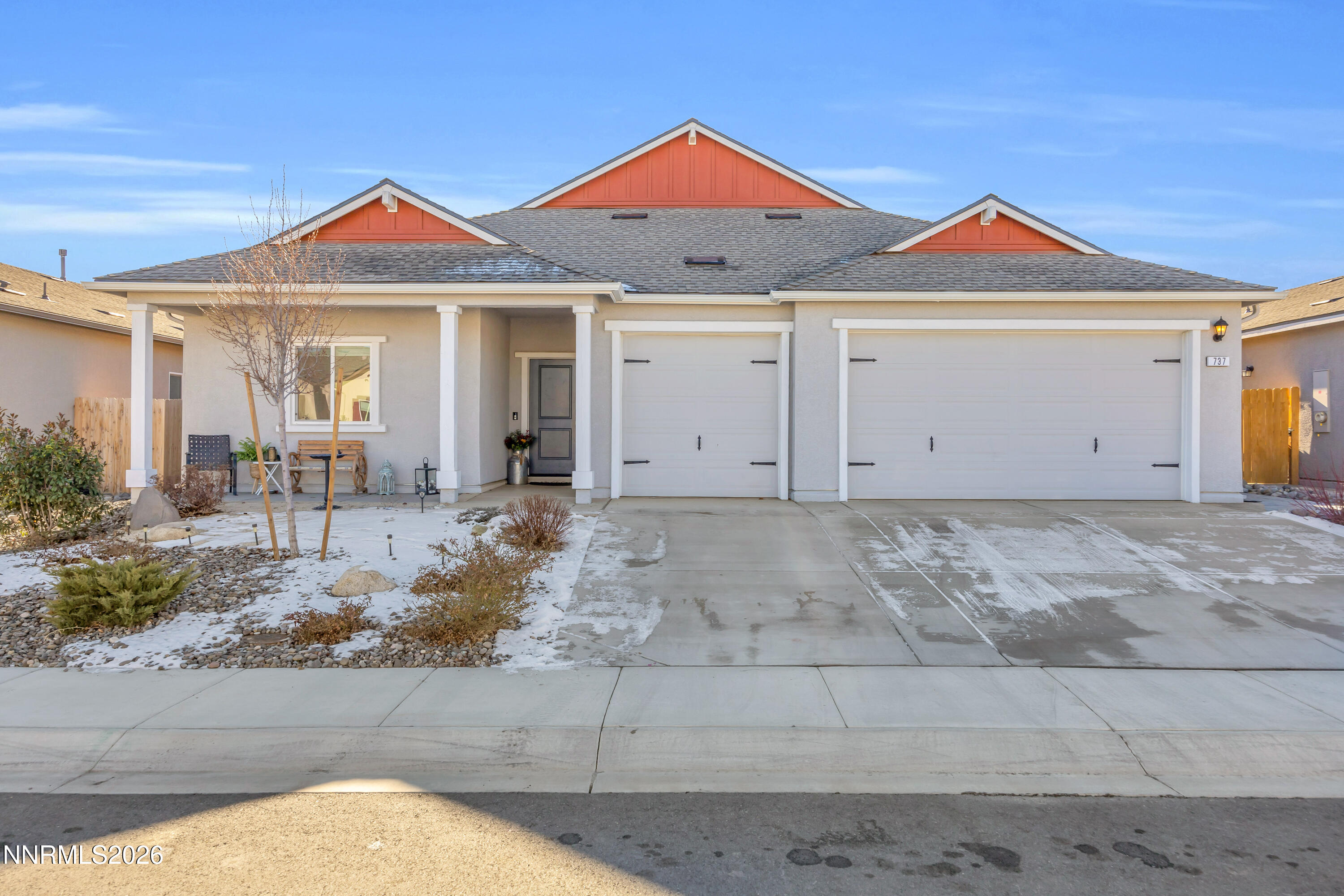737 Butte Crk Road Dayton, NV 89403 - Photo 1 of 34 a front view of a house with a yard and garage