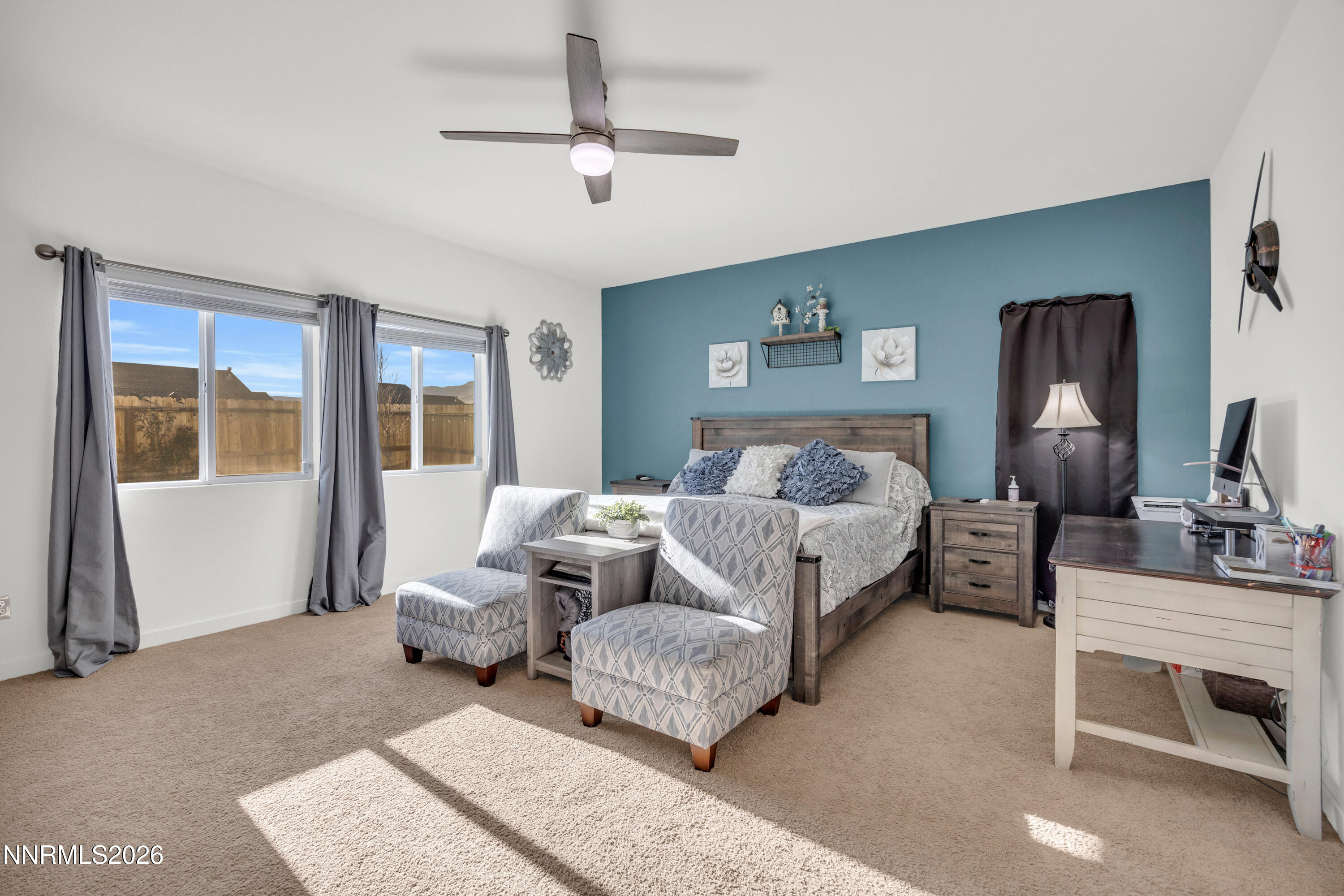 737 Butte Crk Road Dayton, NV 89403 - Photo 11 of 34 a bedroom with a large bed and a couch