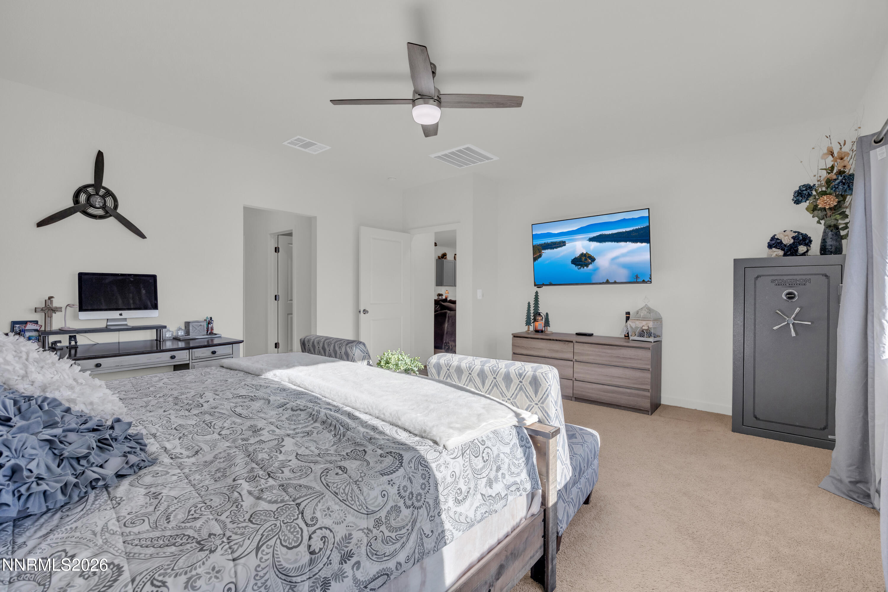 737 Butte Crk Road Dayton, NV 89403 - Photo 12 of 34 a bedroom with a bed and a chandelier