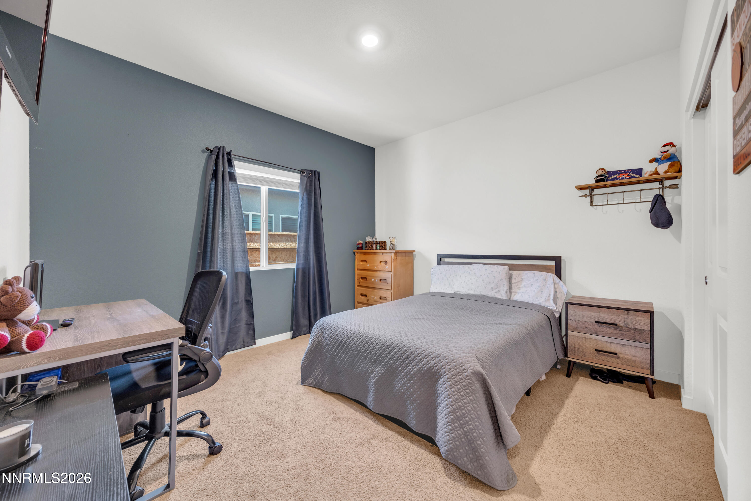 737 Butte Crk Road Dayton, NV 89403 - Photo 18 of 34 a bedroom with a bed a desk and chair
